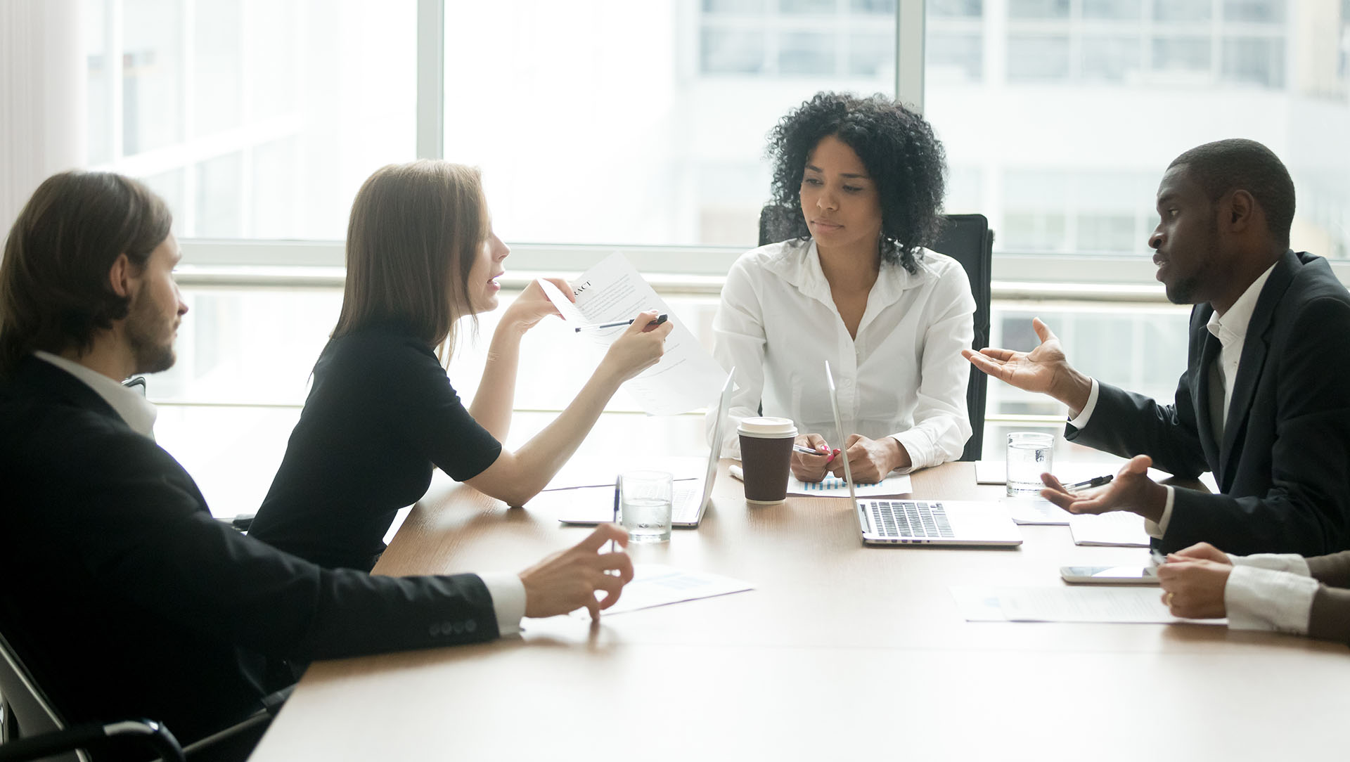 Business partners discussing contract at lawyer's office